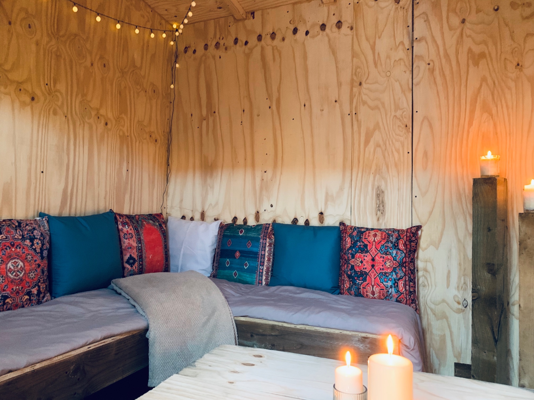 Garden cabin seating with candles